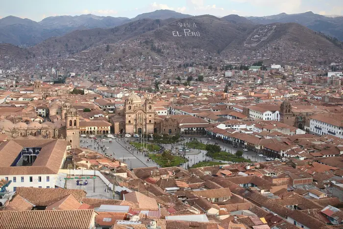 Aerial view of Cusco, with the "Viva el Perú" hillside