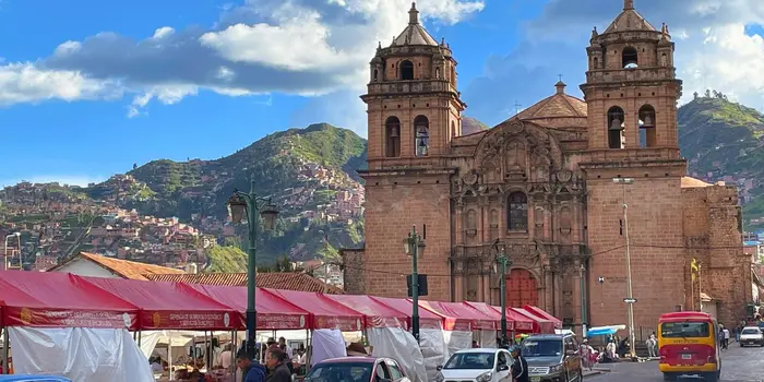 A colonial church next to a street market